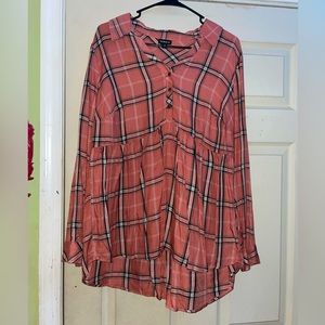 This is a long sleeve plaid shirt. Large 12/14